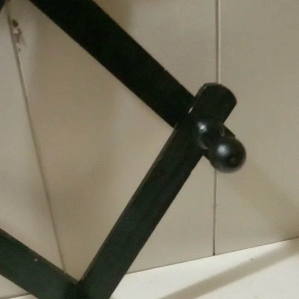 Black Wall-Mounted Coat Rack.